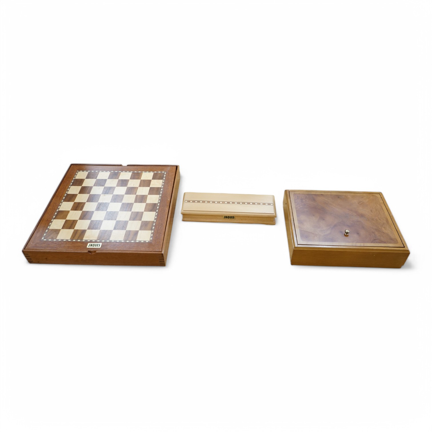 A Jaques chess set and draughts and ‘The Captains Mistress’, all in wooded boxes, largest box 37cm x 37cm. Condition - a few fine scratches